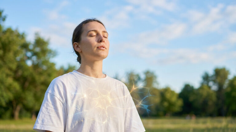 A young adult breathes deeply, eyes closed, in a serene outdoor setting. Ethereal glowing lines symbolize scientific breakthrough and hope.